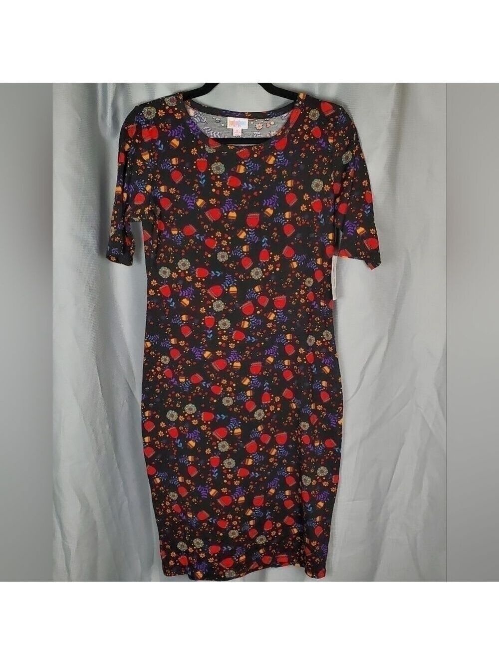 NWT Lularoe Julia, black dress with warm colored floral pattern, size S